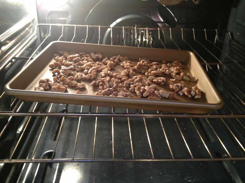 Start by toasting the walnuts. Spread the walnuts in a single layer on a baking sheet. Place in an oven heated to 375, and roast until they start to brown and smell fragrant (about 5-10 min).