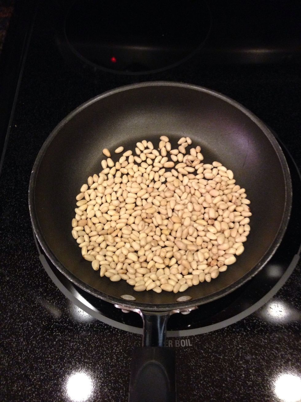 Start by toasting your pine nuts over medium-high heat until golden and fragrant. Shake frequently to avoid burning!