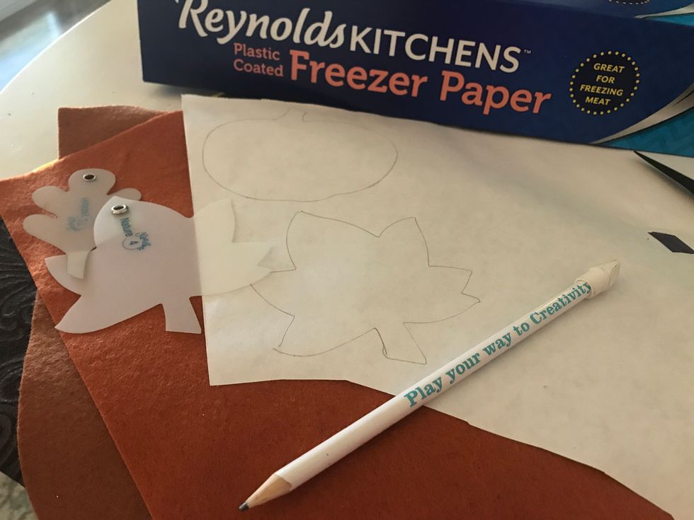 Start by tracing your patterns onto freezer paper