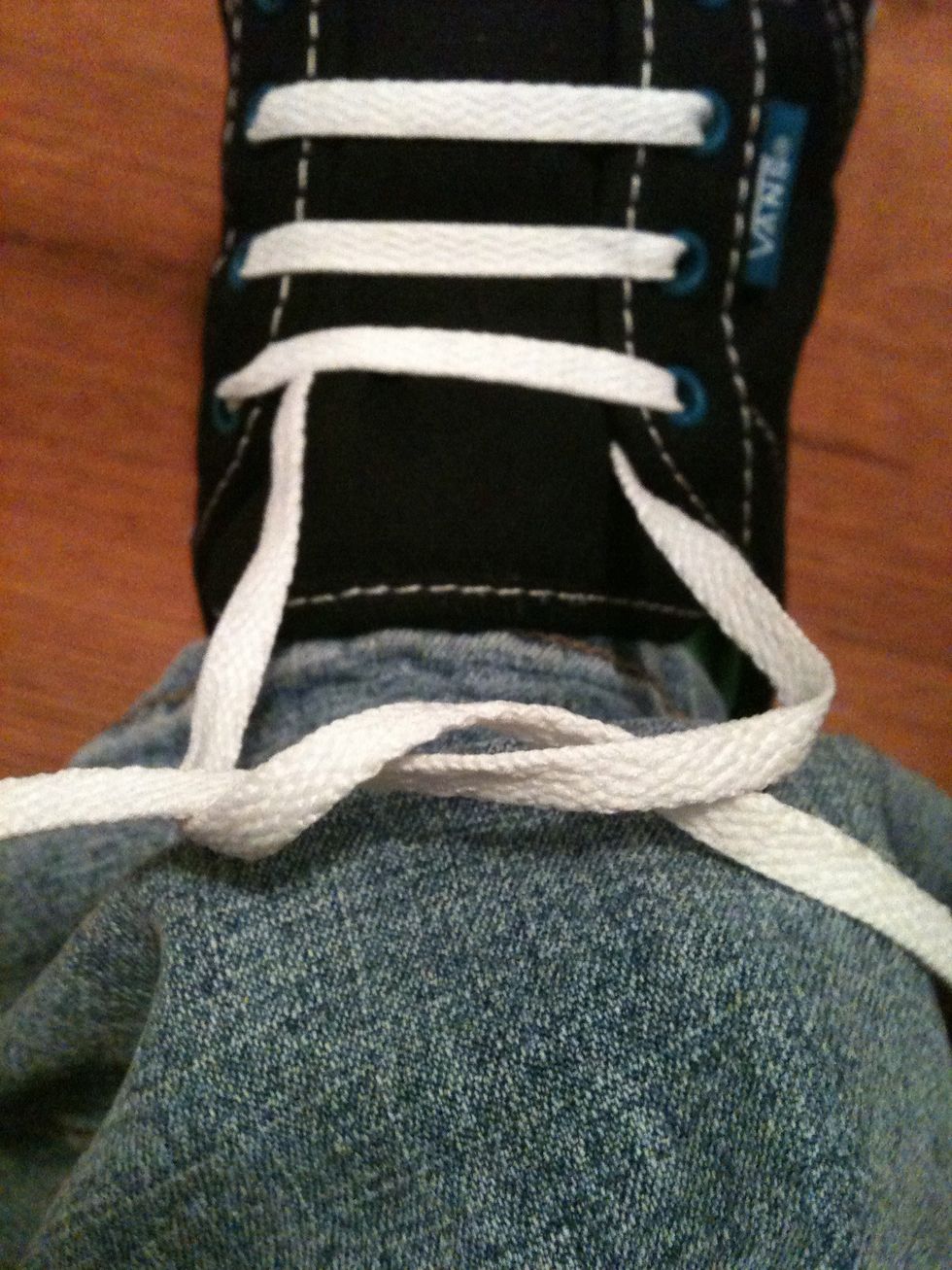 Start by tying a shoelace knot how you usually would