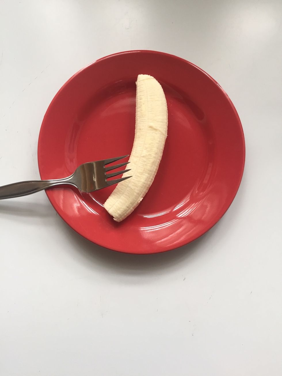 Start by washing and peeling the banana. Then, place it in a dish