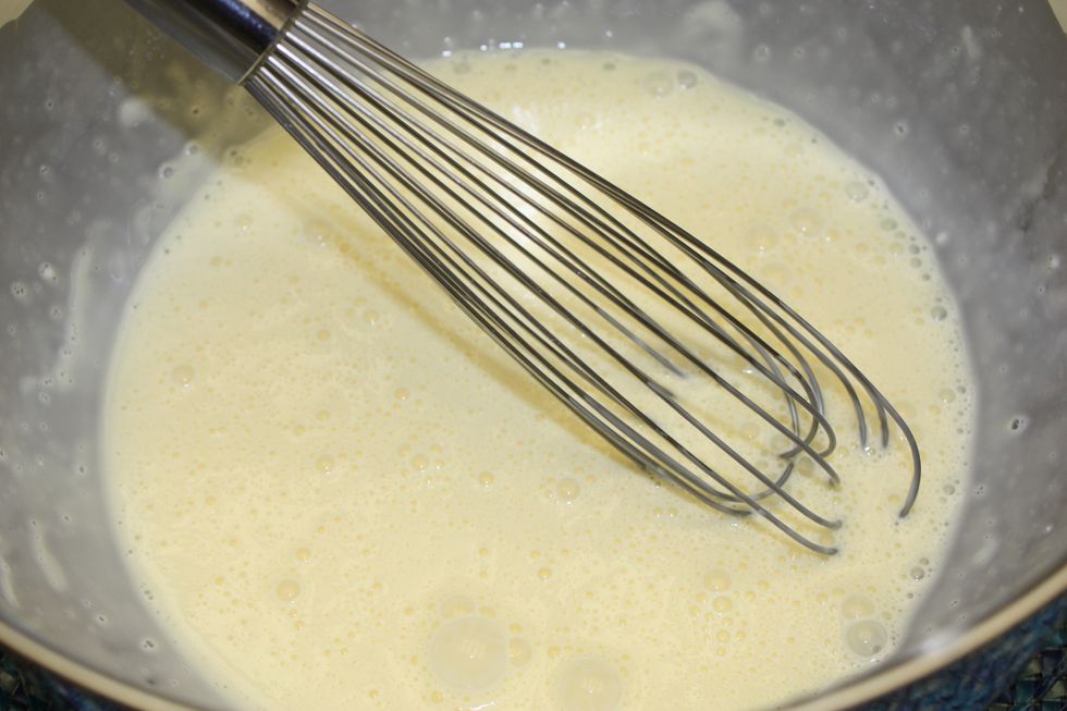 Start by whisking the milk and eggs together.