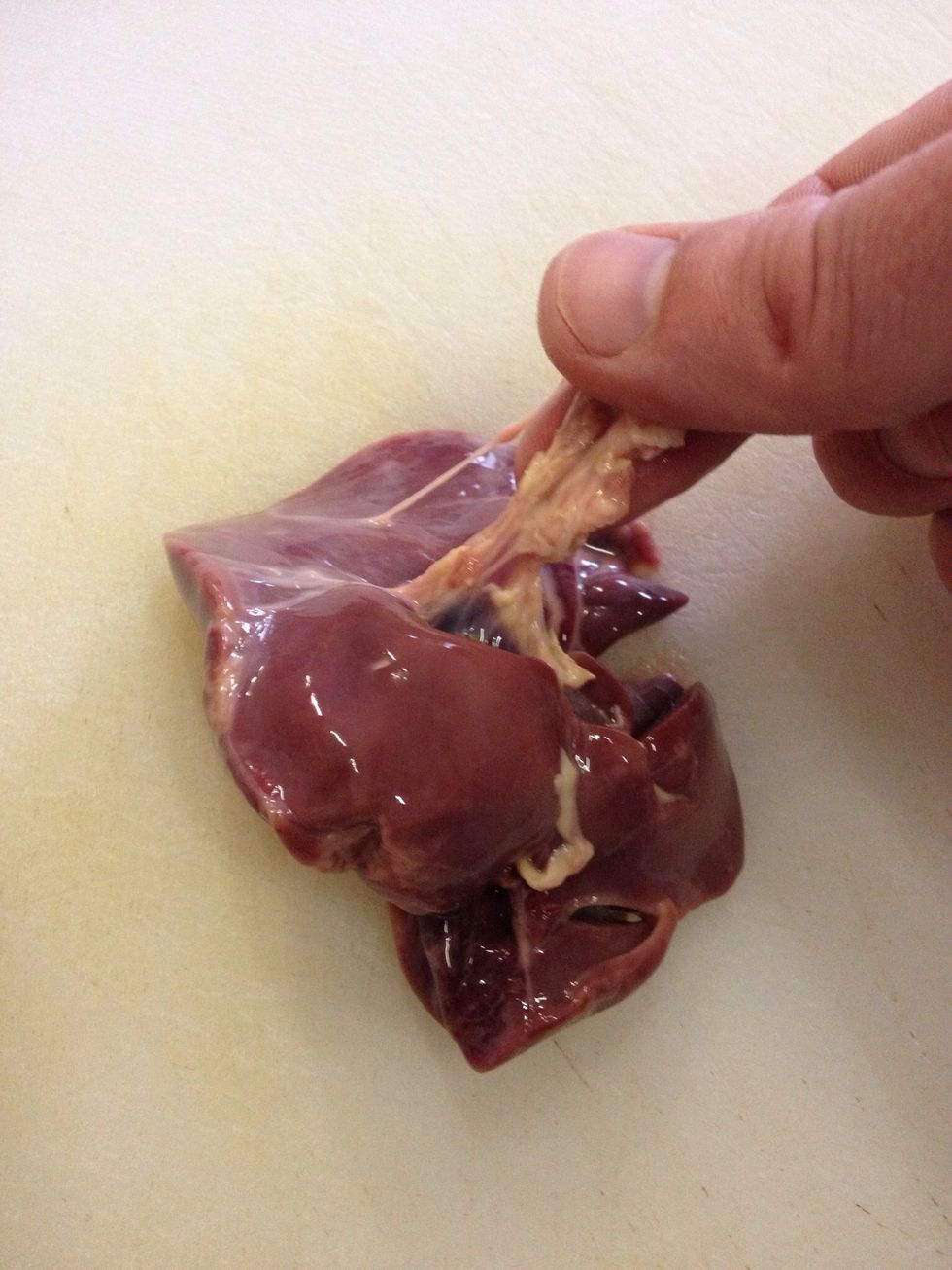 Start cleaning your livers by removing all sinew and any fatty bits