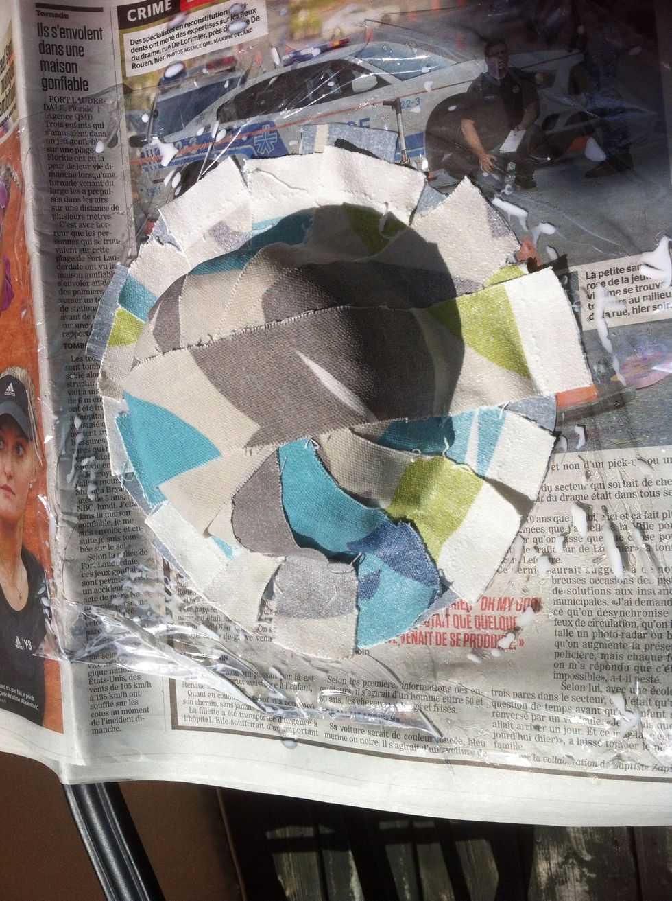 Start covering your bowl with the fabric you want inside, facing the right side down. When its all covered up, take the fabric for the outside, and put it the right side facing up. Let dry for a day