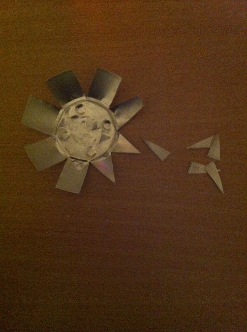 Start cutting off the sides of all the squares to make them triangular.