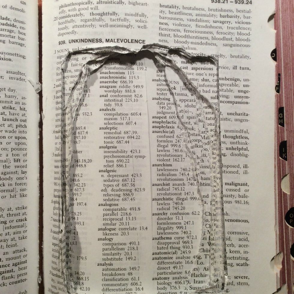 Start cutting your area and then rip some of pages out by hand so that you can fold and manipulate the pages for a more distressed appearance.