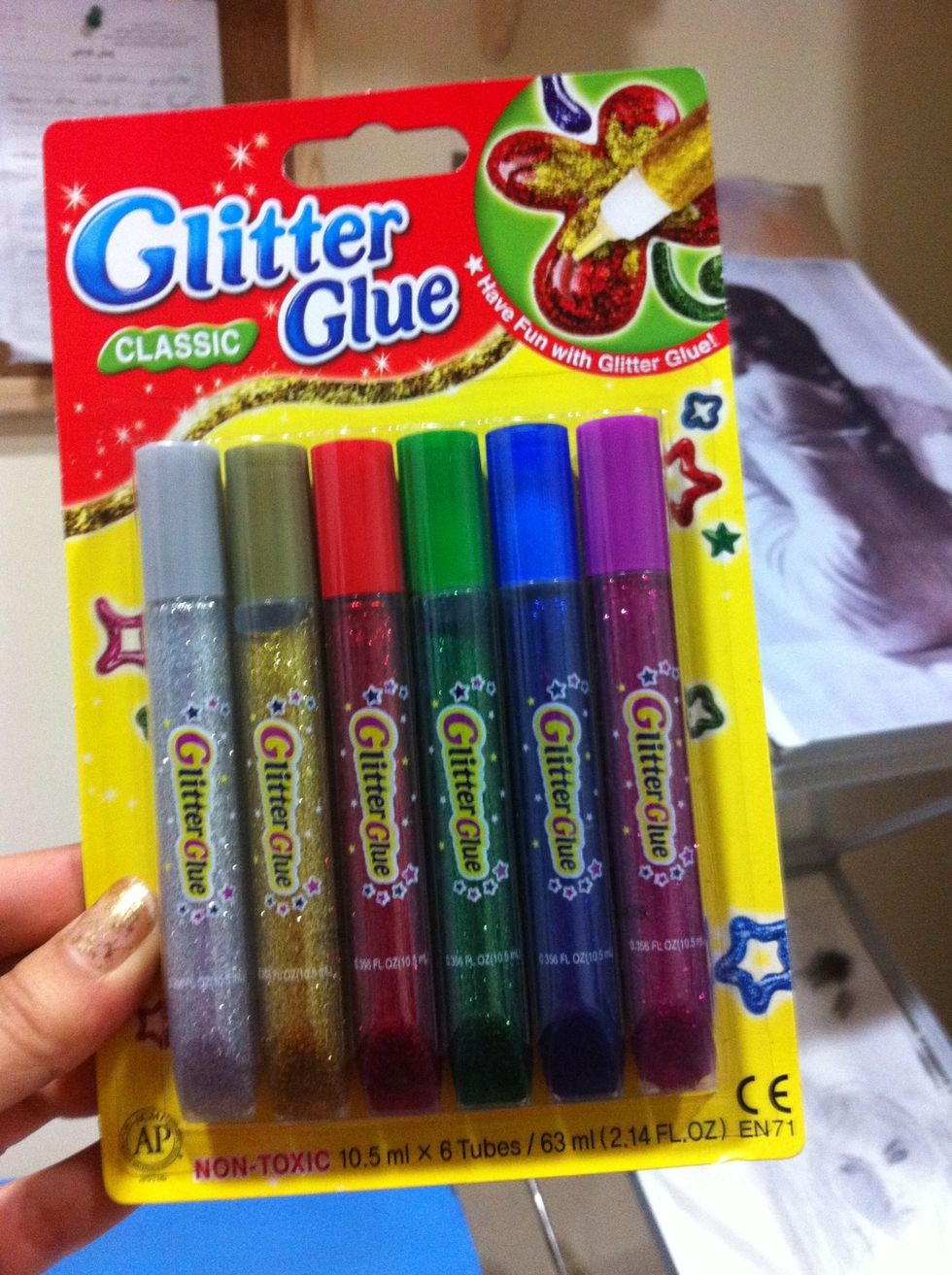 Start designing using glitter glue, flat papers, buttons or anything you like. But mine is only glitter glue coz i want to make a simple one.