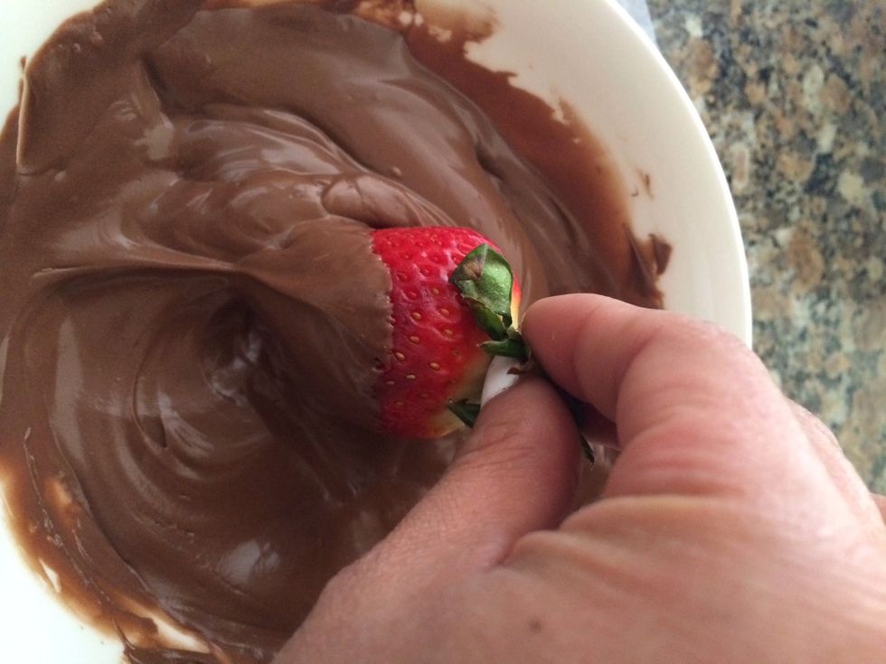 Start dipping... If you can't dip it all move it in a circular motion