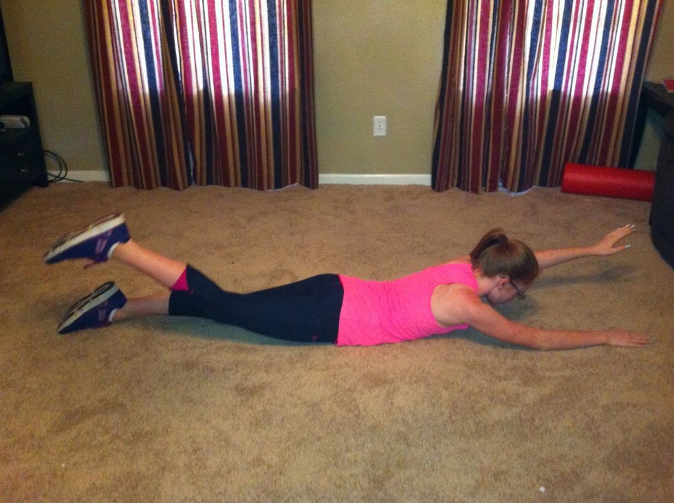 Start face down and raise head, left arm and right leg off floor. Hold for 3 counts.