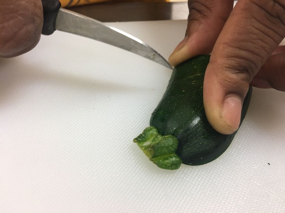 Start from the bottom of the stem and cut triangles along the side all the way to the bottom.