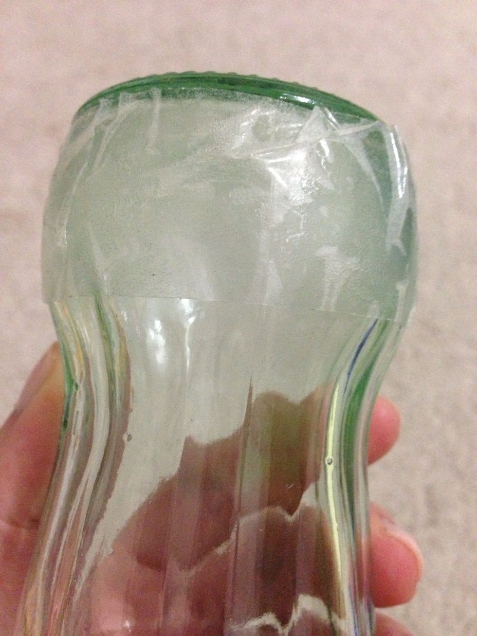 Start from the bottom of your glass bottle and apply double stick tape!
