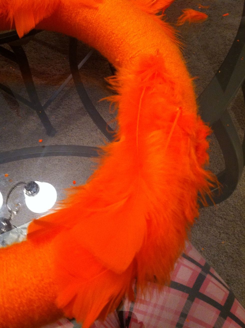 Start gluing feathers on. Make sure they're all going the same direction.