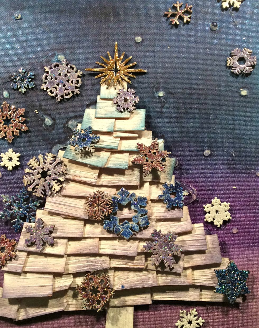 Start gluing on your snowflakes. I used gold Stickles for the start ontop of the tree.