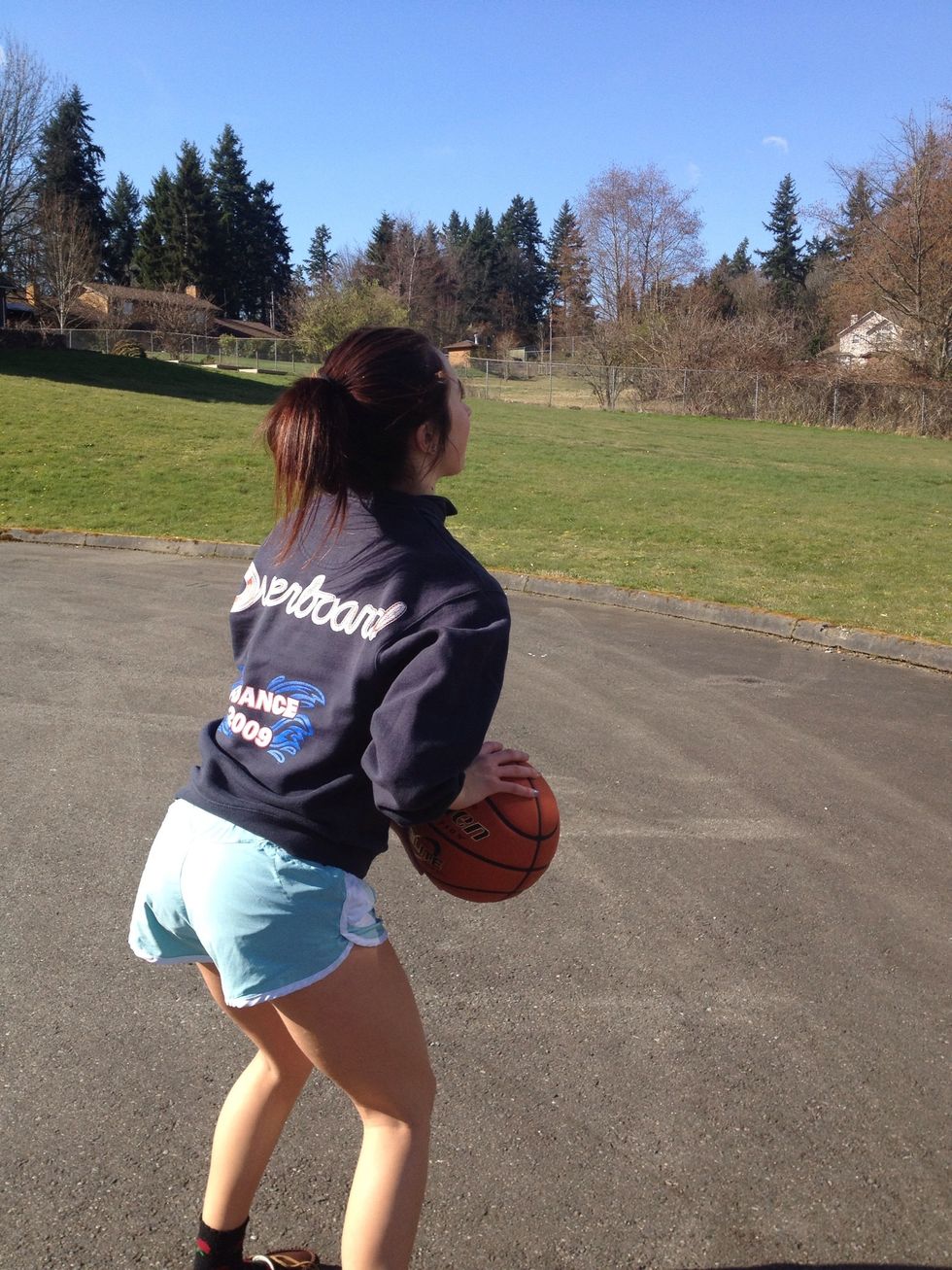 Start I'n a defensive stance, knees bent in triple threat.