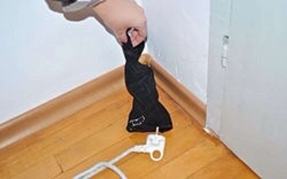 Start in one corner of the room, and move in a circle around the room, picking up any items on the floor, or on the back of chairs as you walk along.