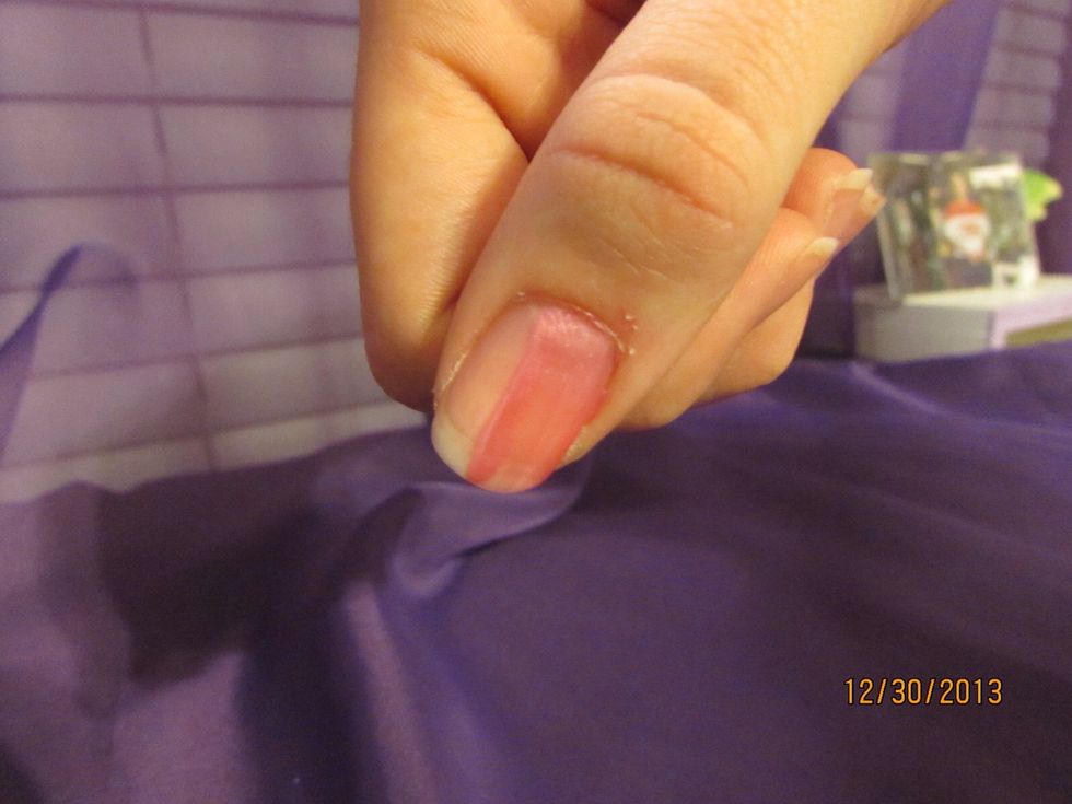 Start in the corner of your nail and stroke the nail polish slowly down into the middle of your nail.