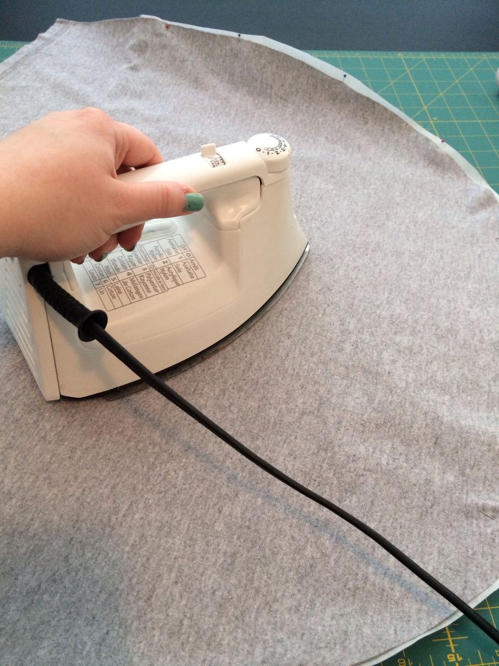 Start in the middle and iron outward. Follow the directions on your adhesive paper package.