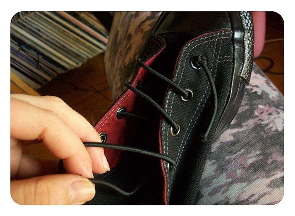 Start lacing your shoes. Start at the toe and do a double knot at the ends so that you have no tying up to do when you wear your shoes. YAY slip-ons!