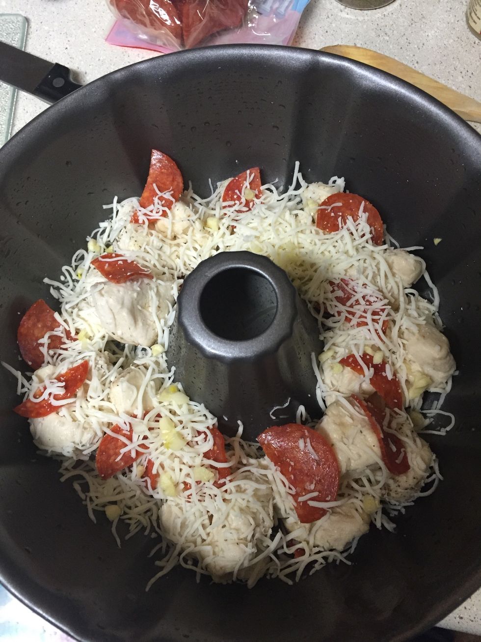 Start layering adding mozz cheese and pepperoni