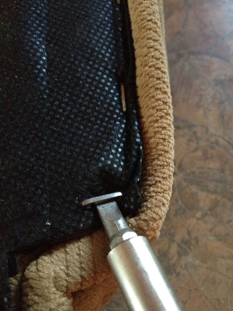 Start lifting up the old staples.