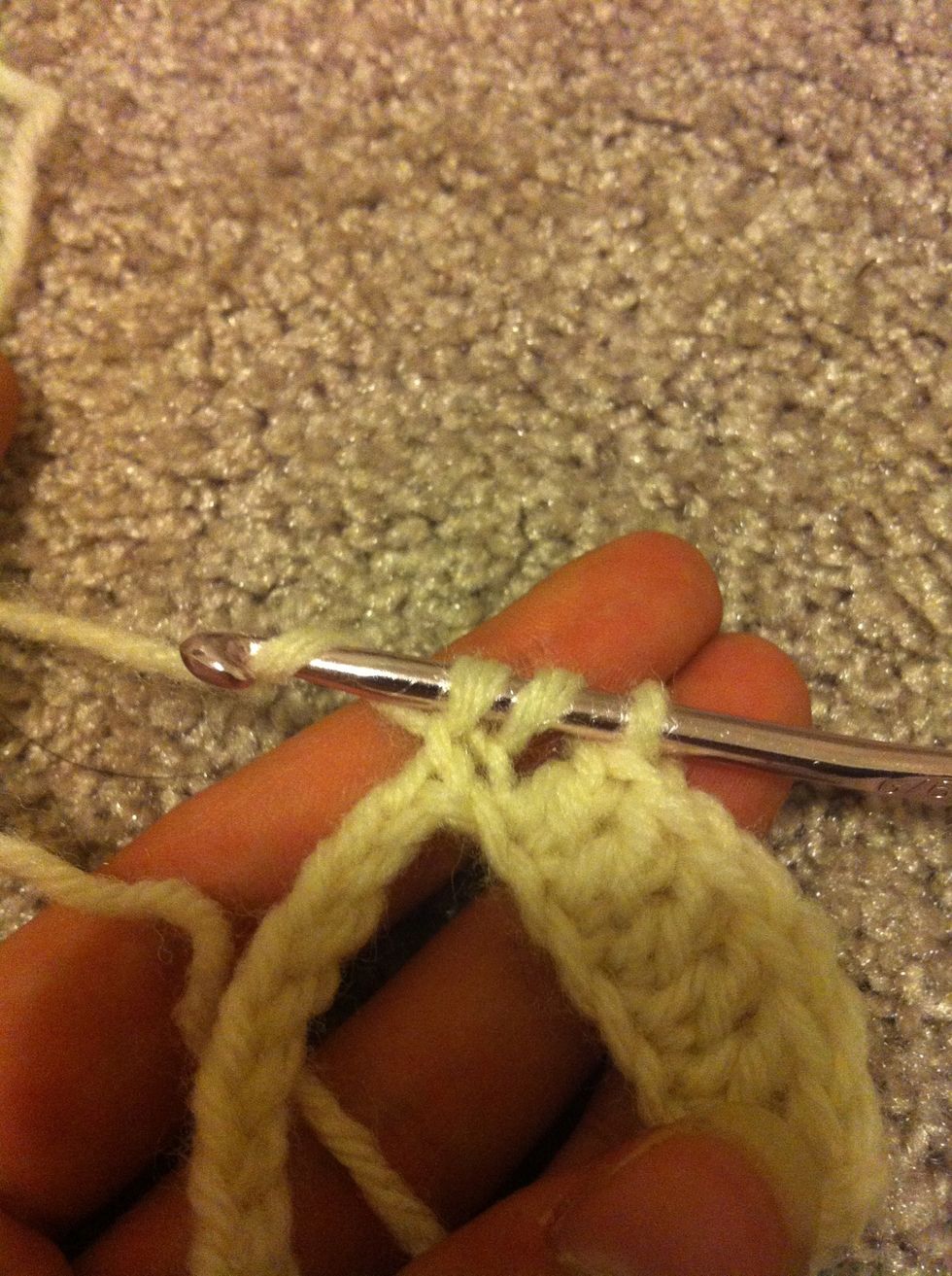 start like normal double crochet in the next chain. pull up a loop like you normally would for it. yarn around again and pull through the first 2 loops on you hook.