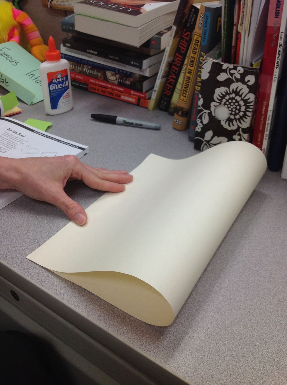 Start like you're going to make a hamburger fold - match the edges, but DON'T crease the fold yet!