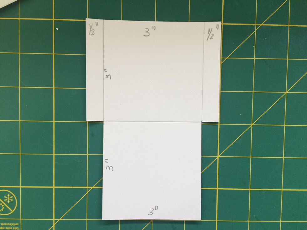 Start making six pockets measuring 3"x3"with two tabs measuring 1/2".