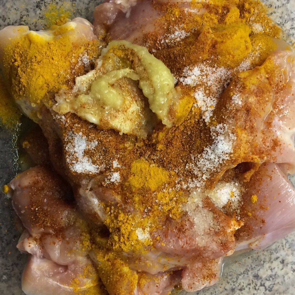 Start marinating the chicken with 1 tsp of ground turmeric, 1 tsp of cayenne pepper, 1 tsp of salt as well as 1 tsp each of ginger and garlic pastes.