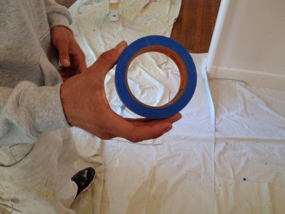 Start masking off the woodwork using blue tape.
