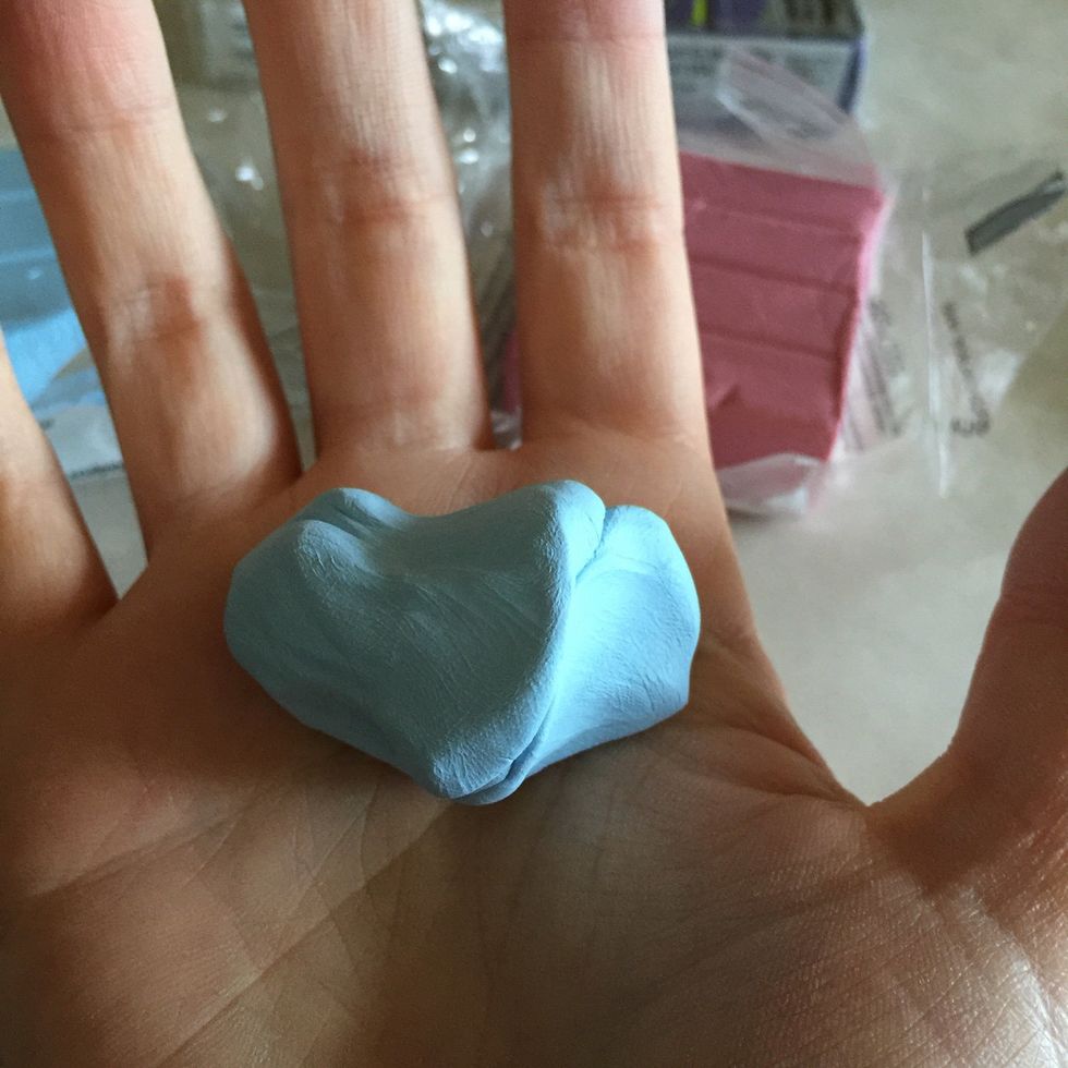Start massaging the clay into your hands. It will start to get a little bit softer and easier to work with.