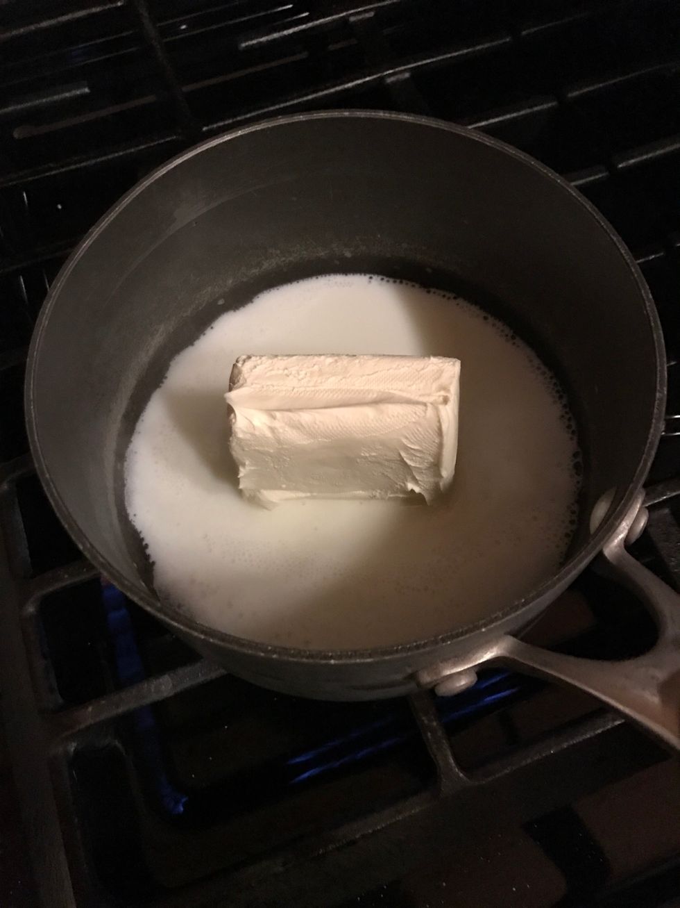Start melting cream cheese into the milk while stirring (3 minutes)
