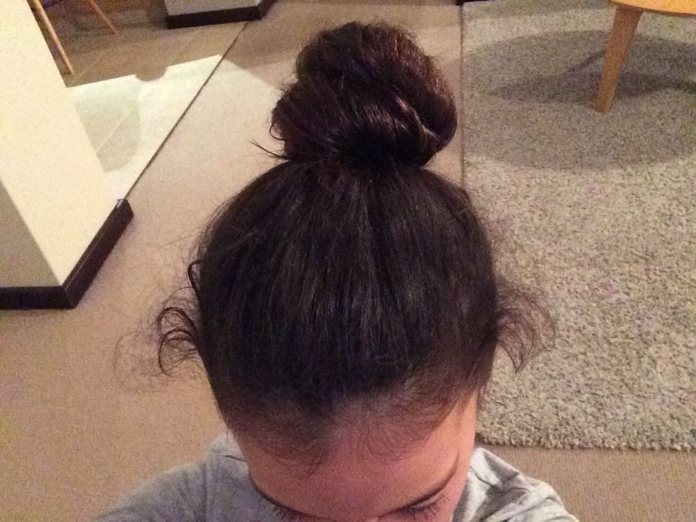 Start of by getting your hair out of the way with a hair tie.