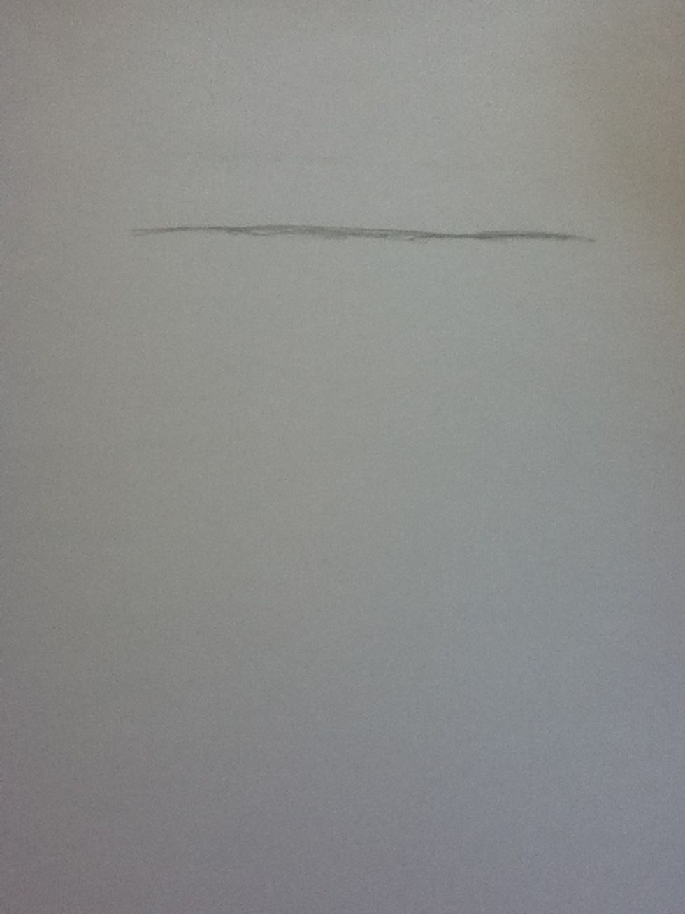 Start off by drawing the top of his head.