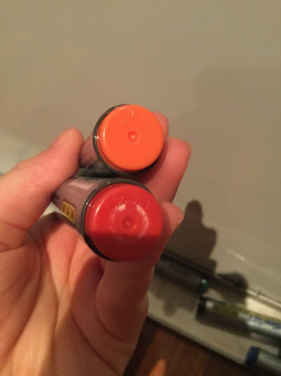 Start off by grabbing an orange or red. I'm using red because my orange had dried out. If you want you can always try to use yellow. This will be for the cone.