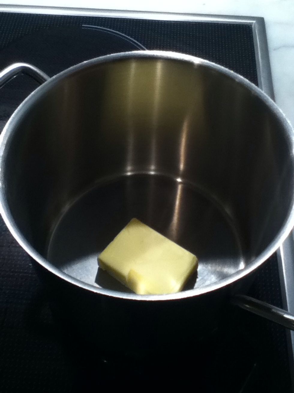 Start off by melting 50 grams of butter, and set it aside while we mix the dry ingredients.