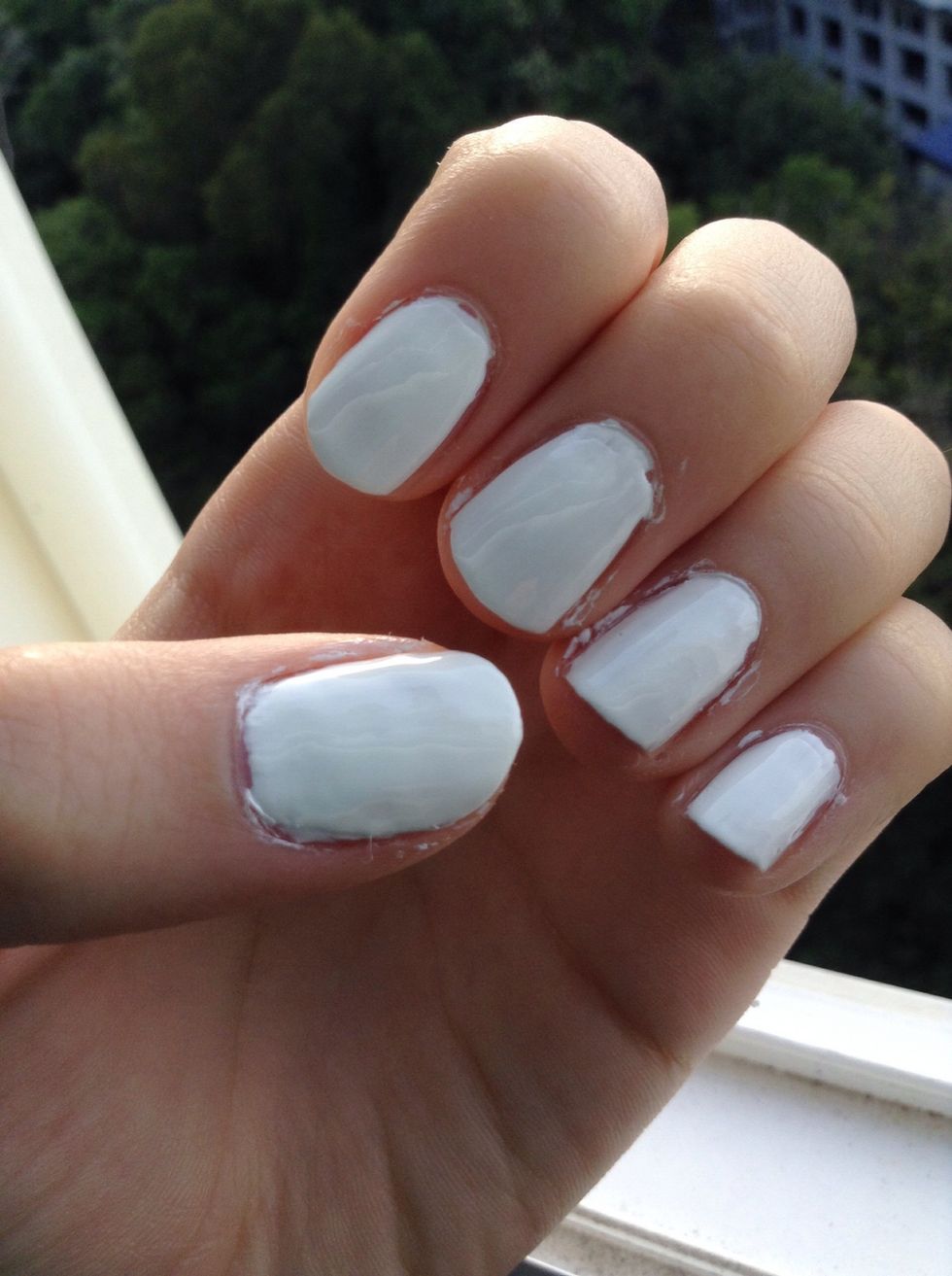 Start off by painting your nails two coats of white:)