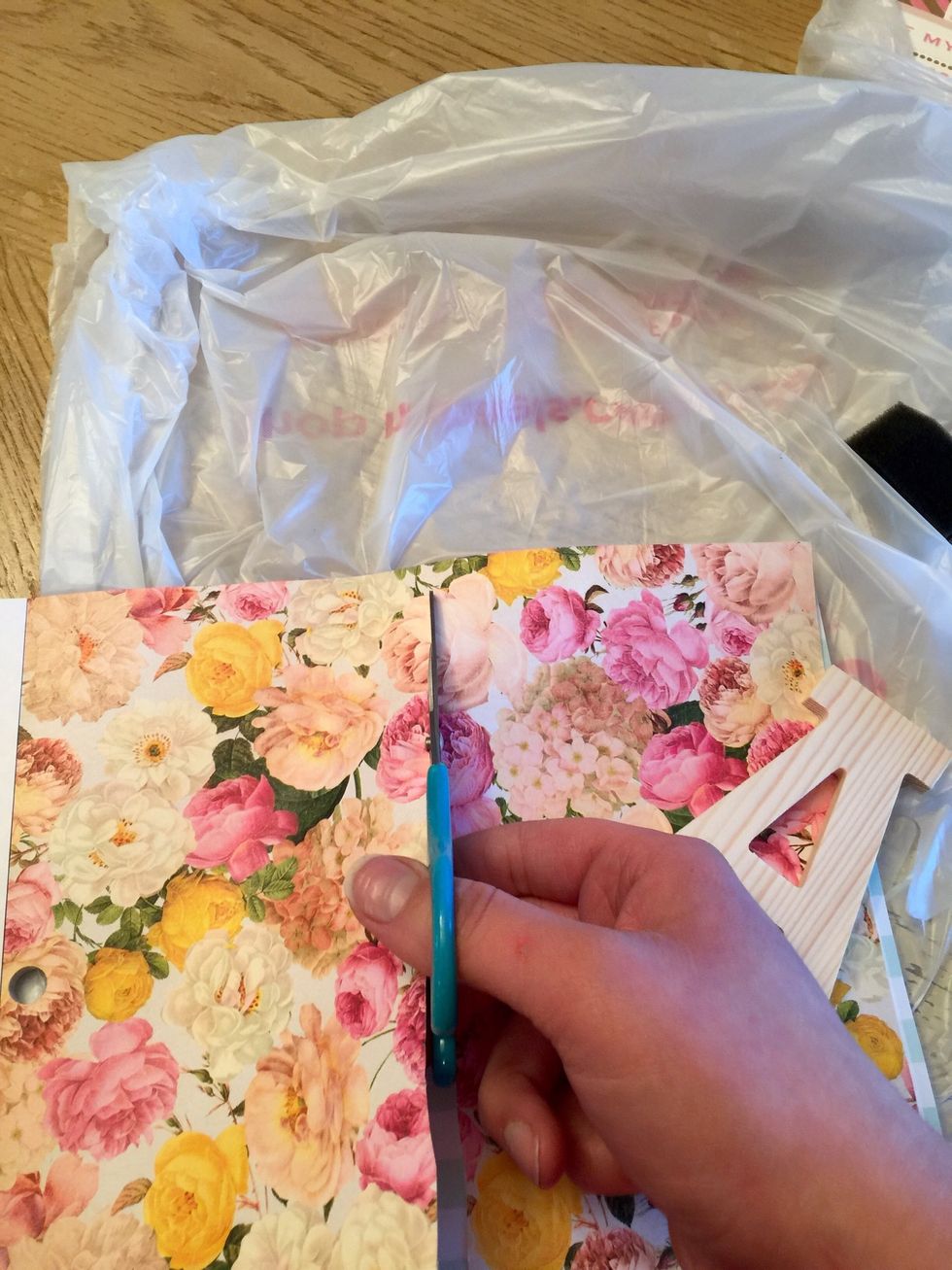Start off by picking the design paper (scrapbook paper) and the wooden letters spelling what you want to spell out.