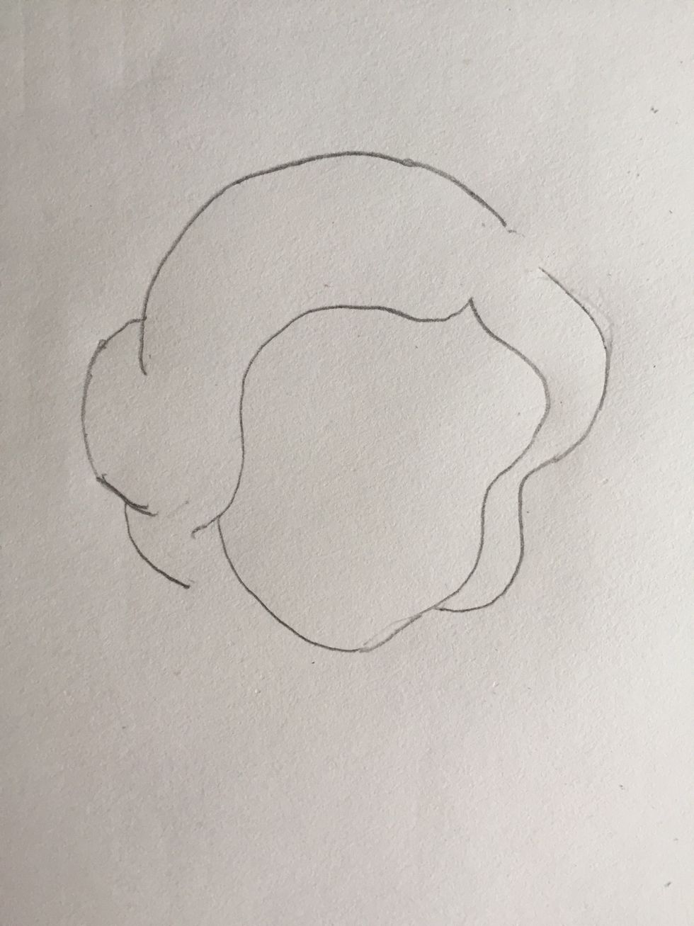 Start off by sketching the outline of Snow White's face, and her hair. Leave a small space on the right for her headband, we'll add that in later.