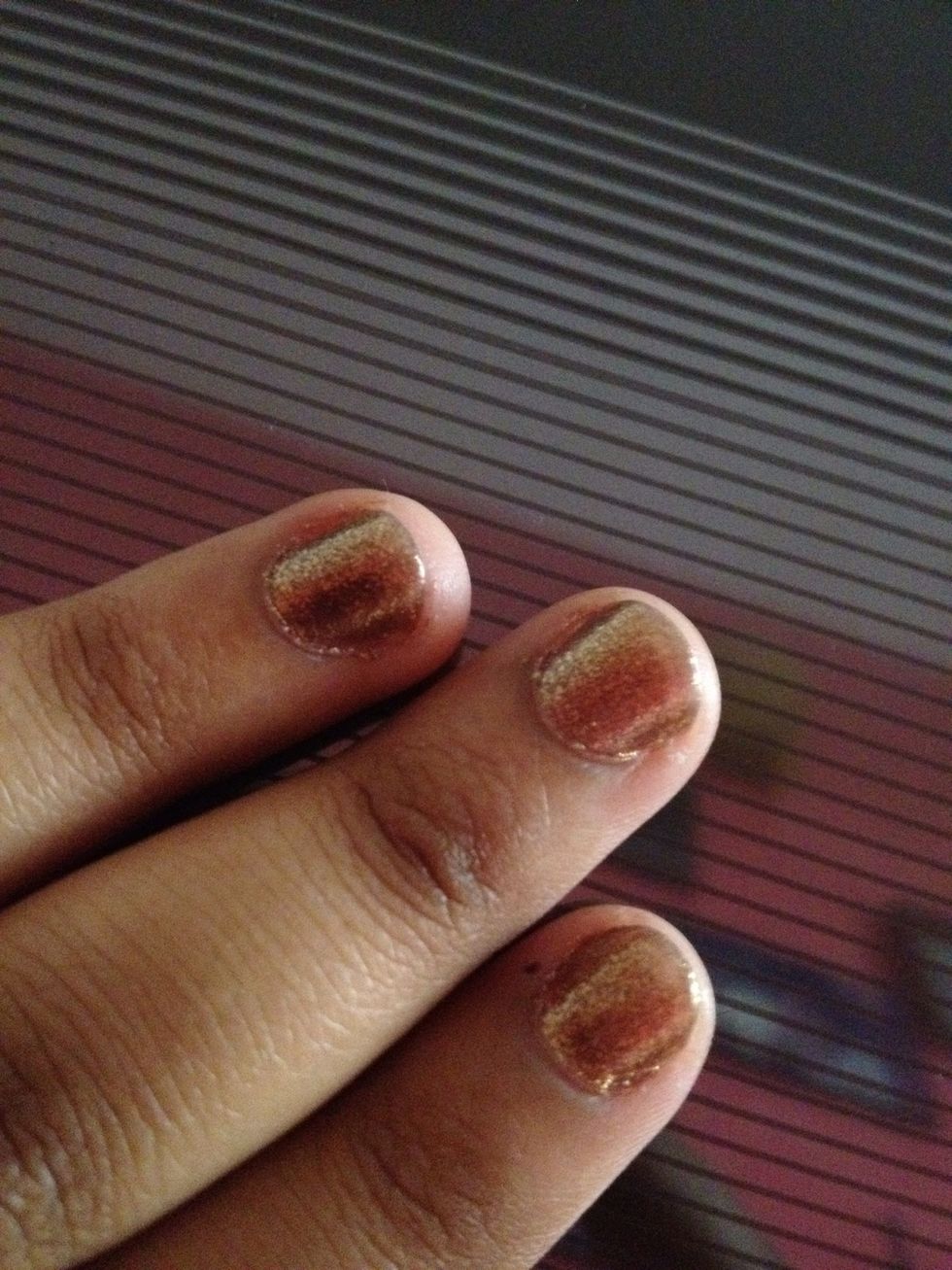 Start off with a base coat. Then apply the base colour. I've used a shimmery bronze colour. But, you can use any shimmery or sparkly colour.