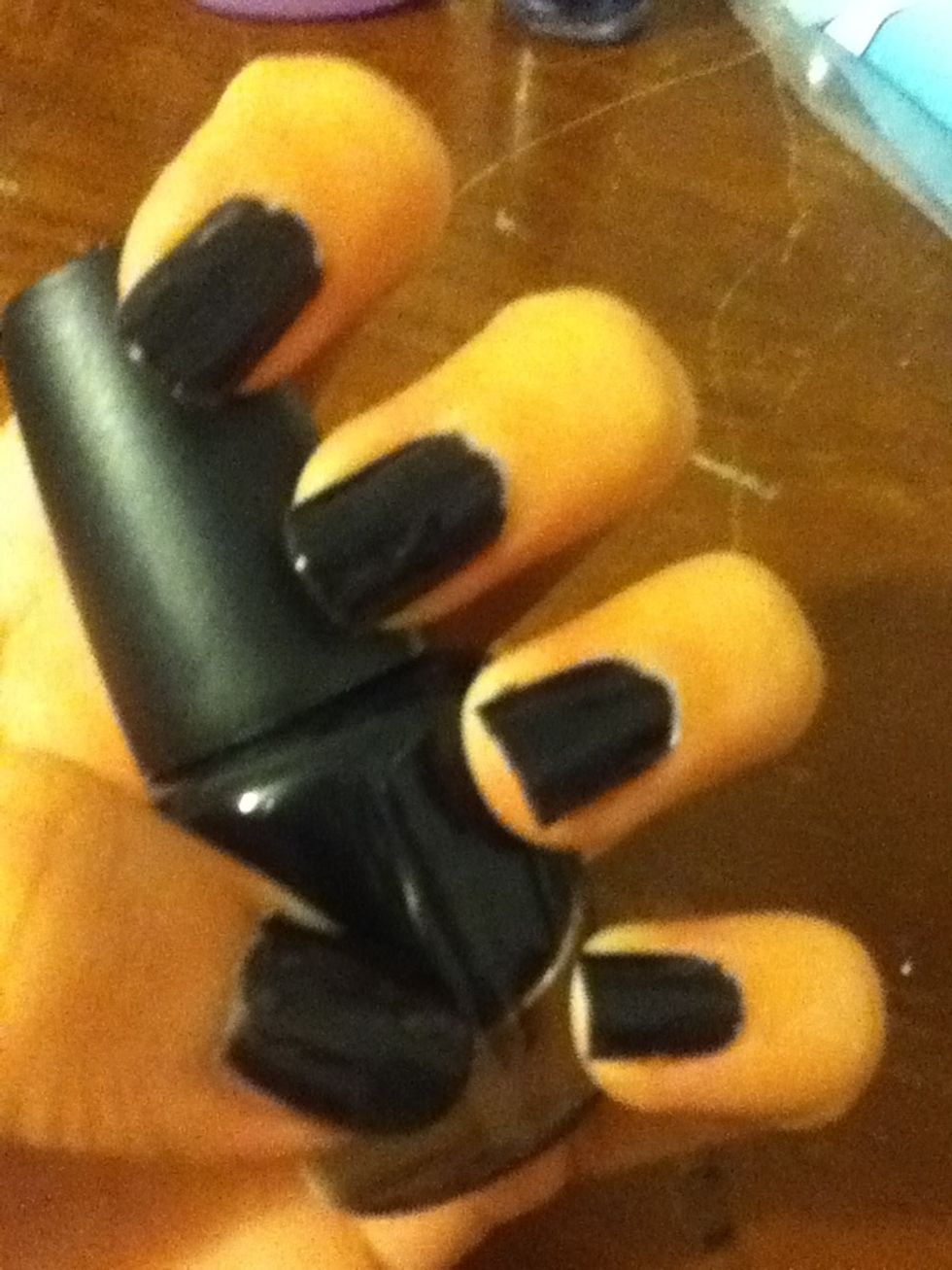 Start off with a base coat, then paint your nails two coats of your primary color. The best method to apply polish is to stroke the brush down the middle of the nail, then down each side.