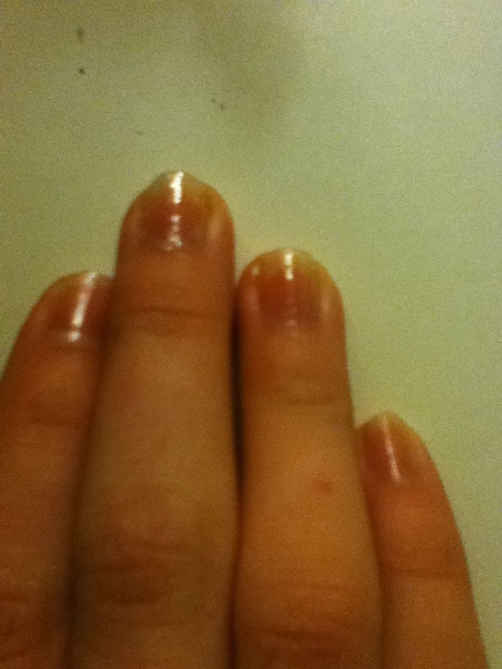 Start off with a clear base coat on both your hands. Leave to dry.