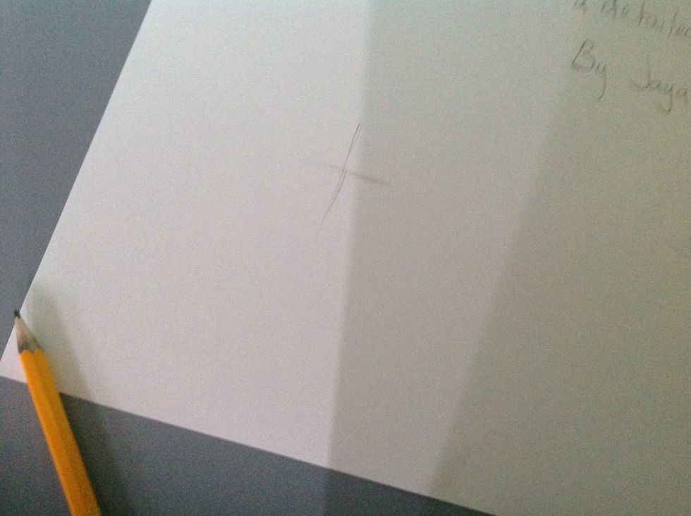 Start off with a little cross on the page.