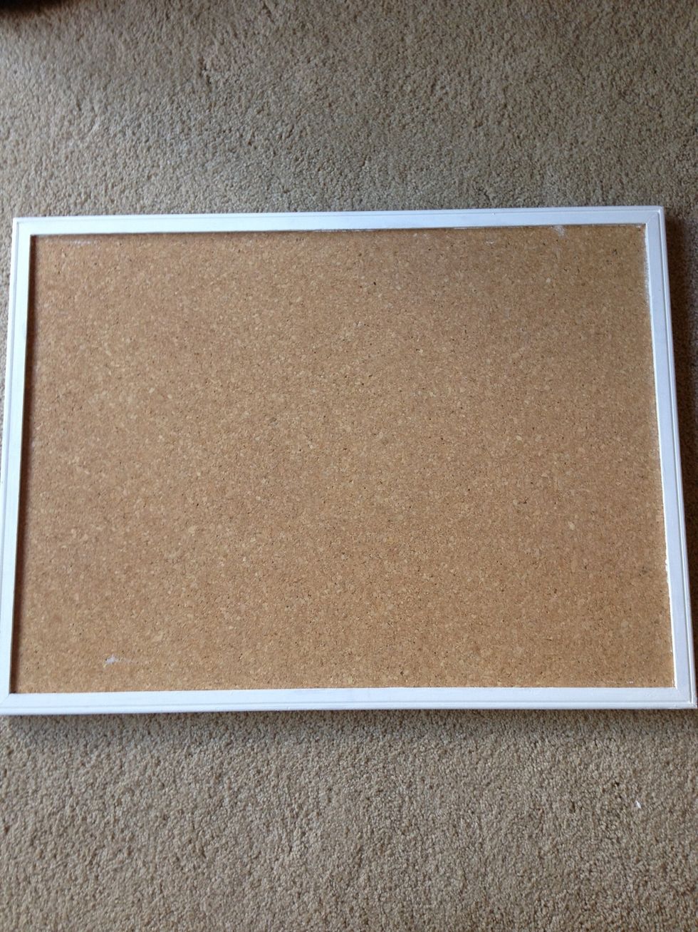 Start off with a plain cork board (or a thick poster board). I painted the framework on mine white to personalize it and make it fun!