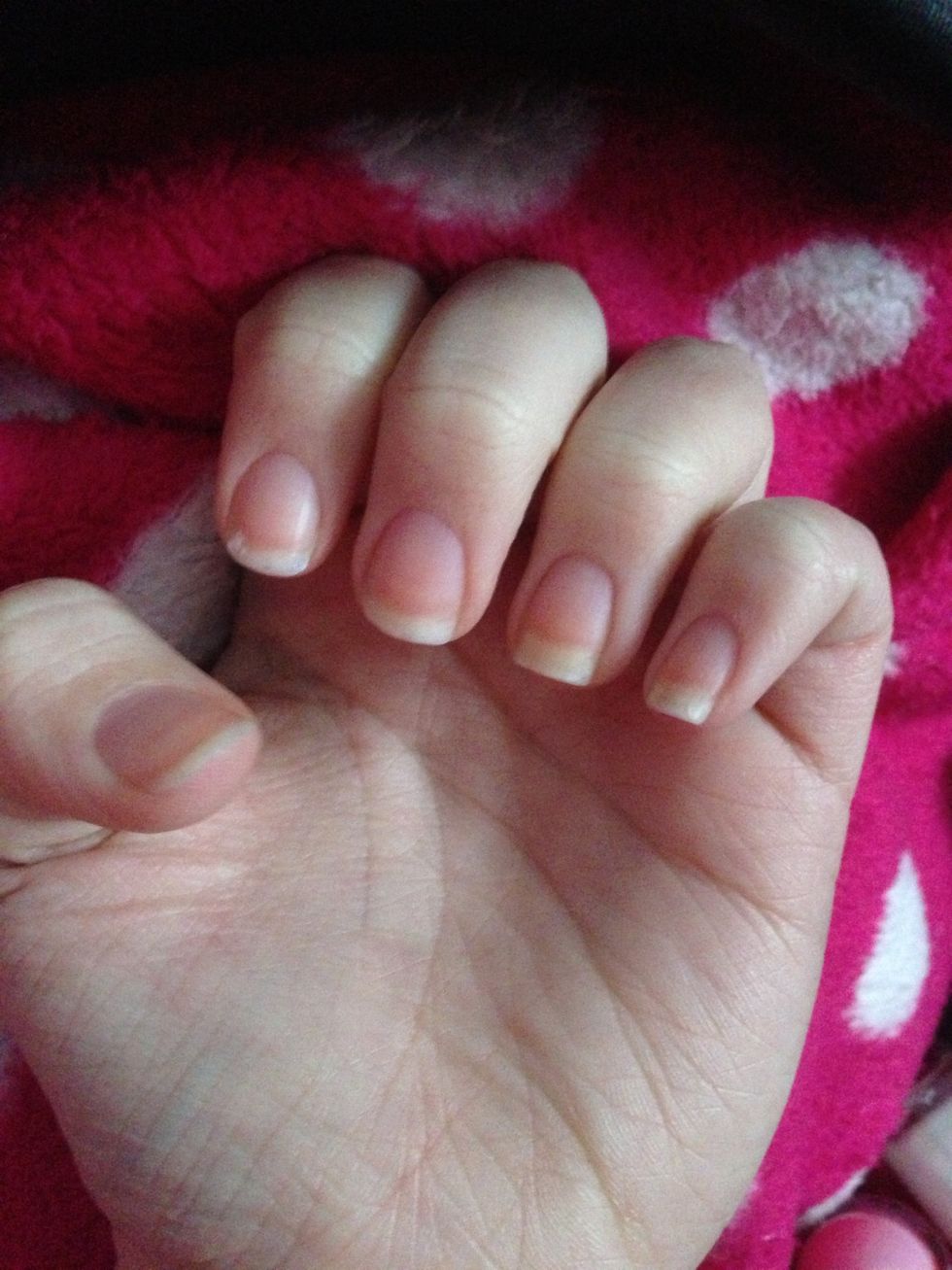 Start off with clean nails and add a base clear coat
