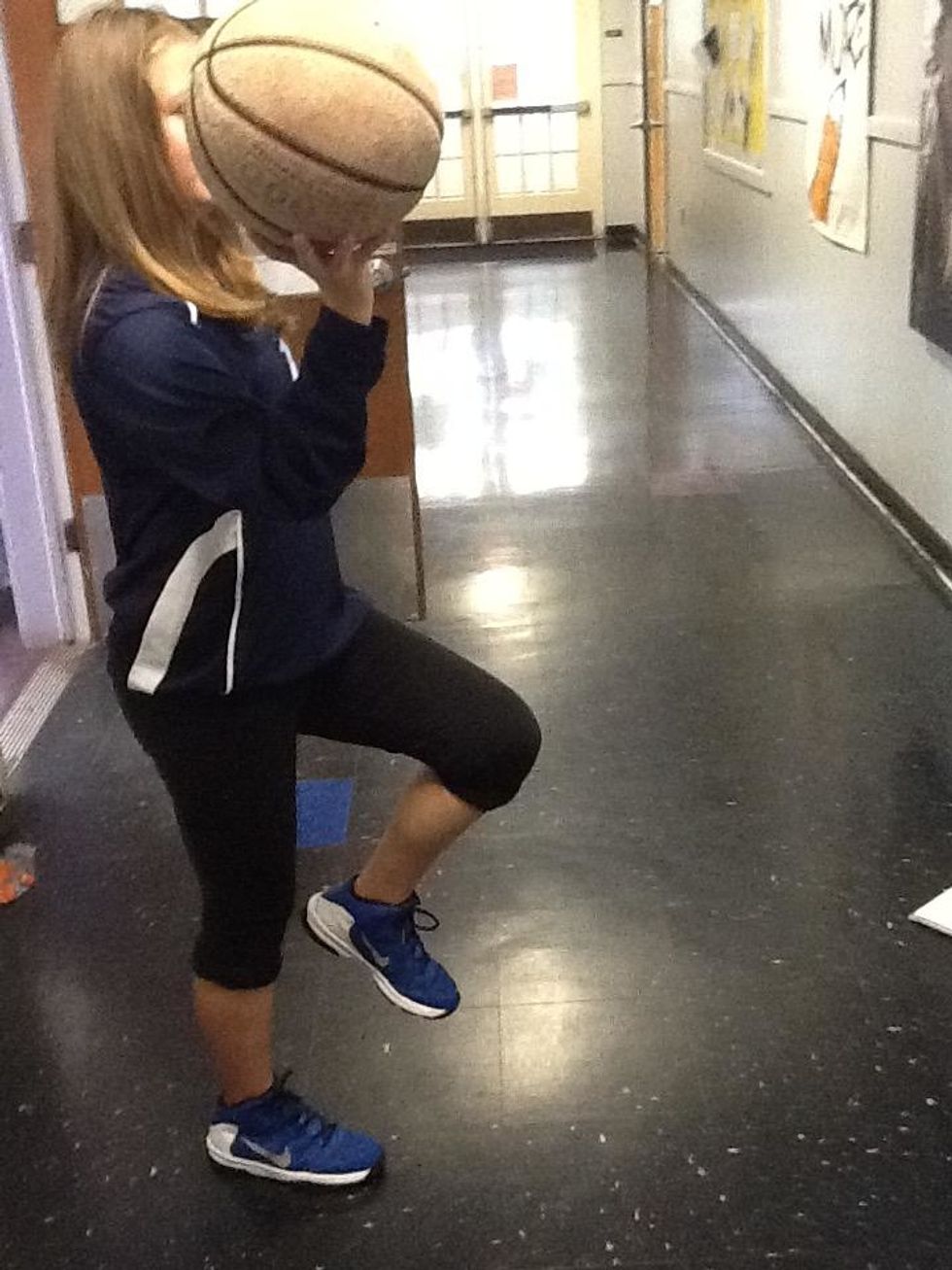 Start off with practicing your form in one place. As you can see, I'm lifting my right leg with the ball in my right hand