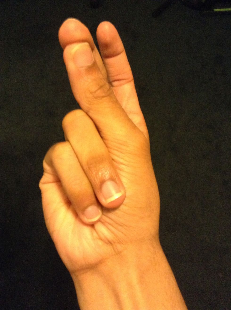 Start off with your fingers positioned like this and make sure your fingertips are dry to make it easier.