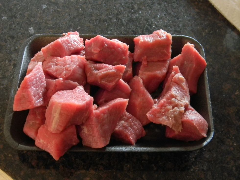 Start out with a chunk of lean beef. Cut off any extra fat  and cube it into mouth-sized pieces. Or you could also just buy ready cut beef to safe time.