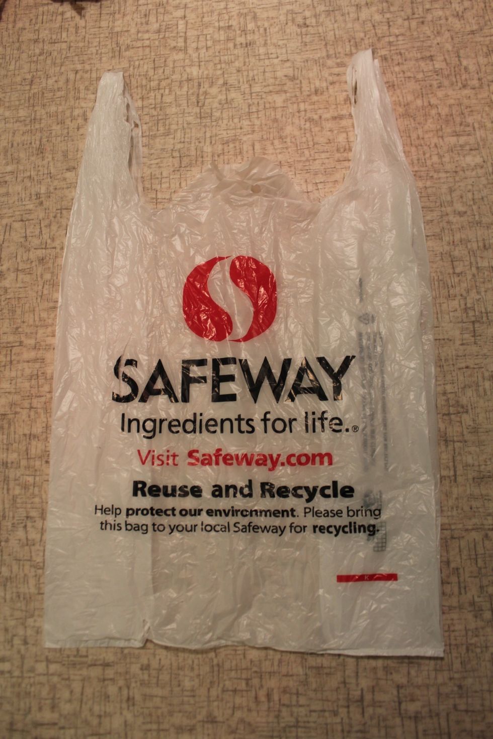 Start out with a plastic bag smoothed out to be flat