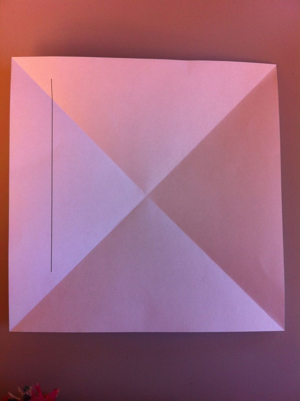 Start out with a square piece of paper. Fold it on the diagonalis.