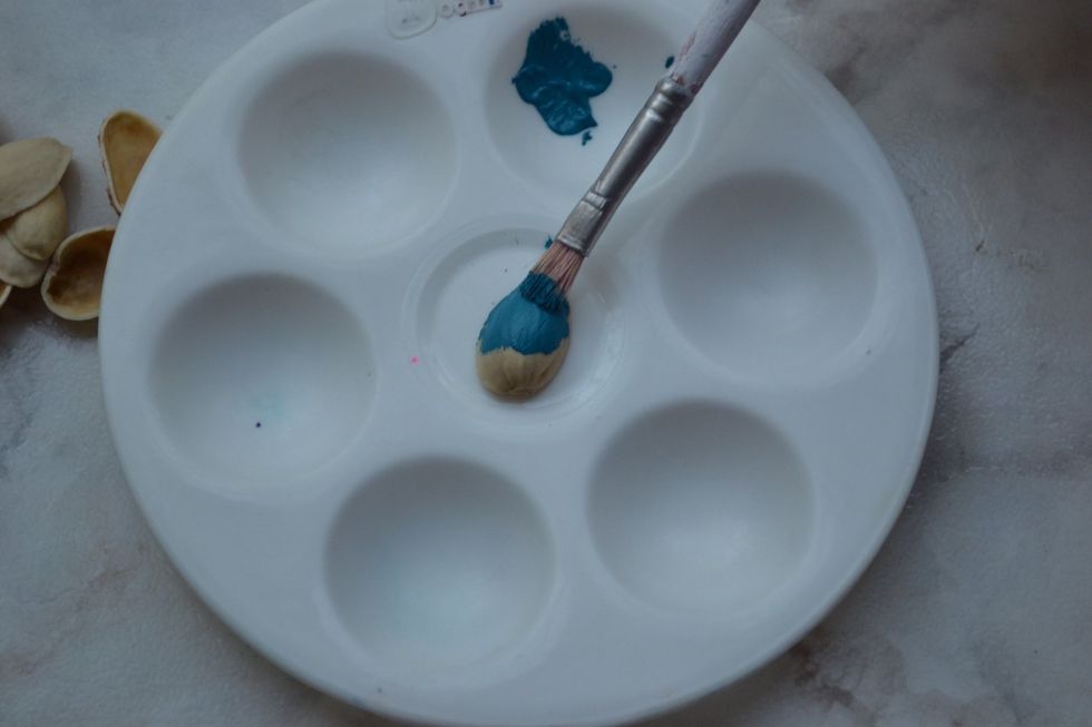 Start painting how ever you want the pistachio shells